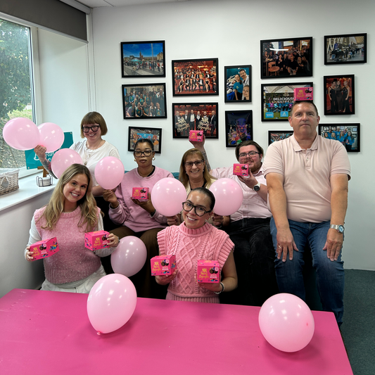 Monty Bojangles team at Truffle HQ celebrating the launch of Checky Scoffy in pink