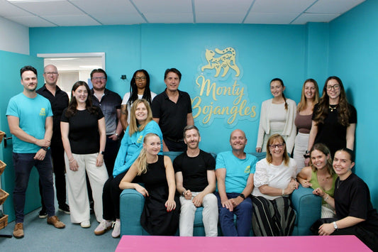 Team Monty Bojangles posing against the new teal wall