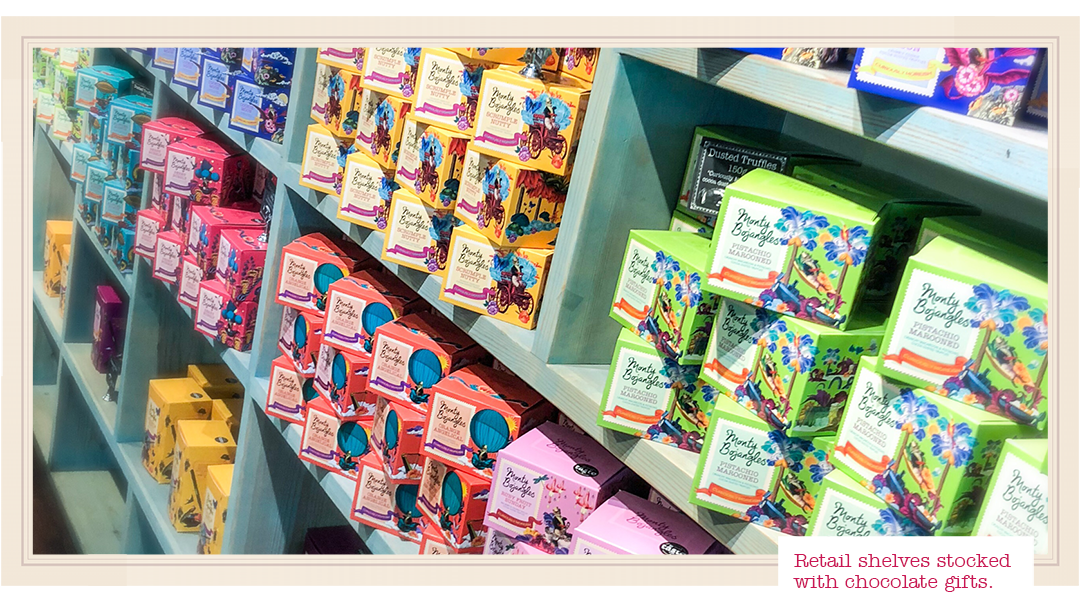 Monty Bojangles Truffle Bar Coffee Shop - retail shelves full of chocolate gift boxes.